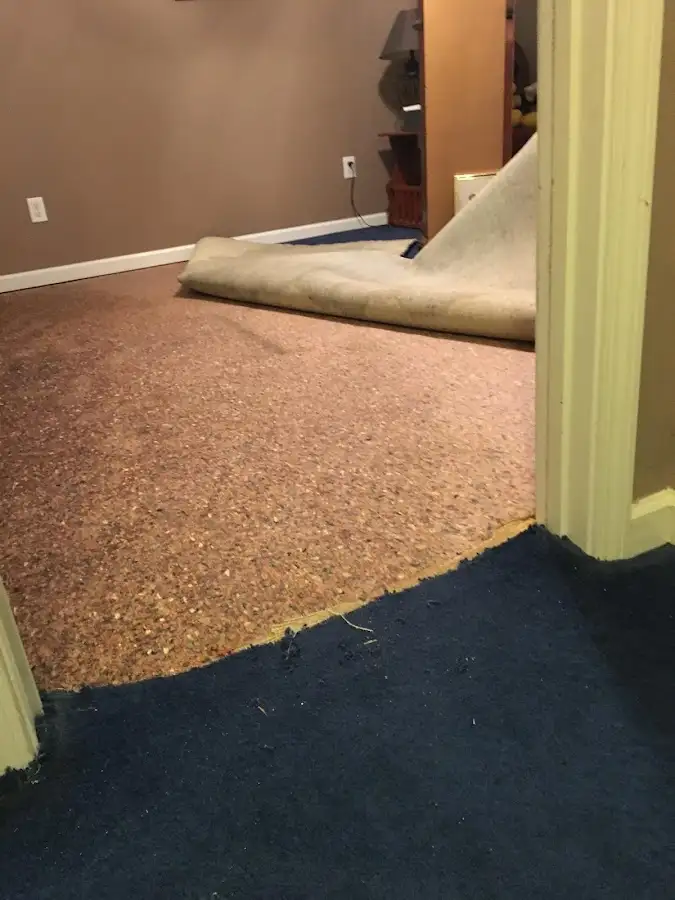 Carpet pad removal revealing water damage during Drying & Dehumidification in Escalon