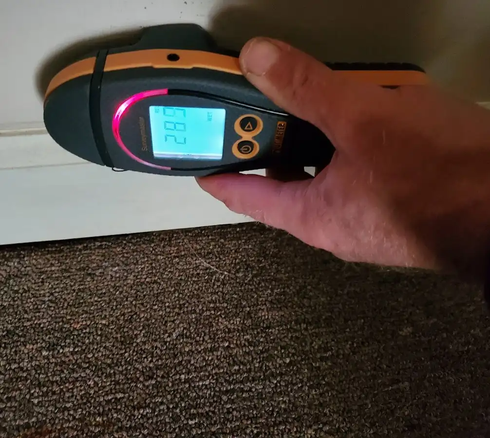 Moisture detection at baseboard during Storm Damage Restoration in Escalon